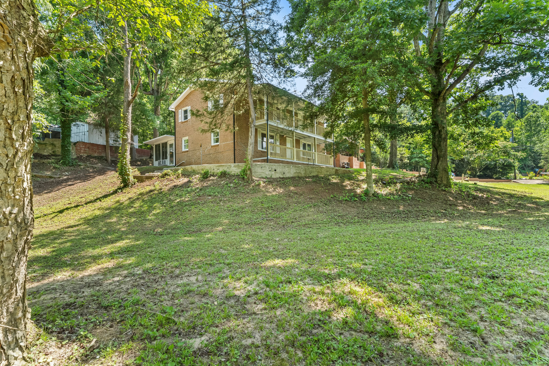 Renovated two-story brick home on Emorywood Dr in Burke County, NC with double covered porches