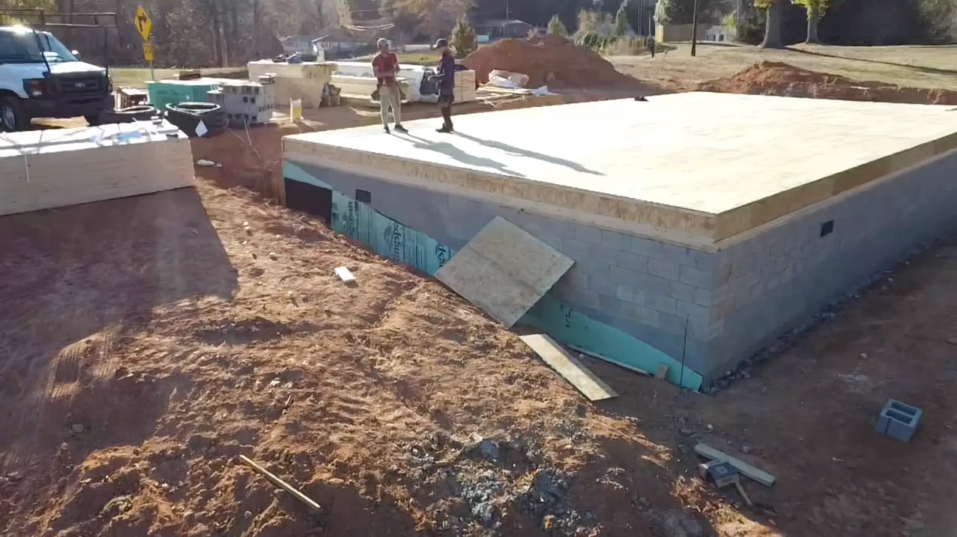 Block foundation with subfloor decking installed on the first new build
