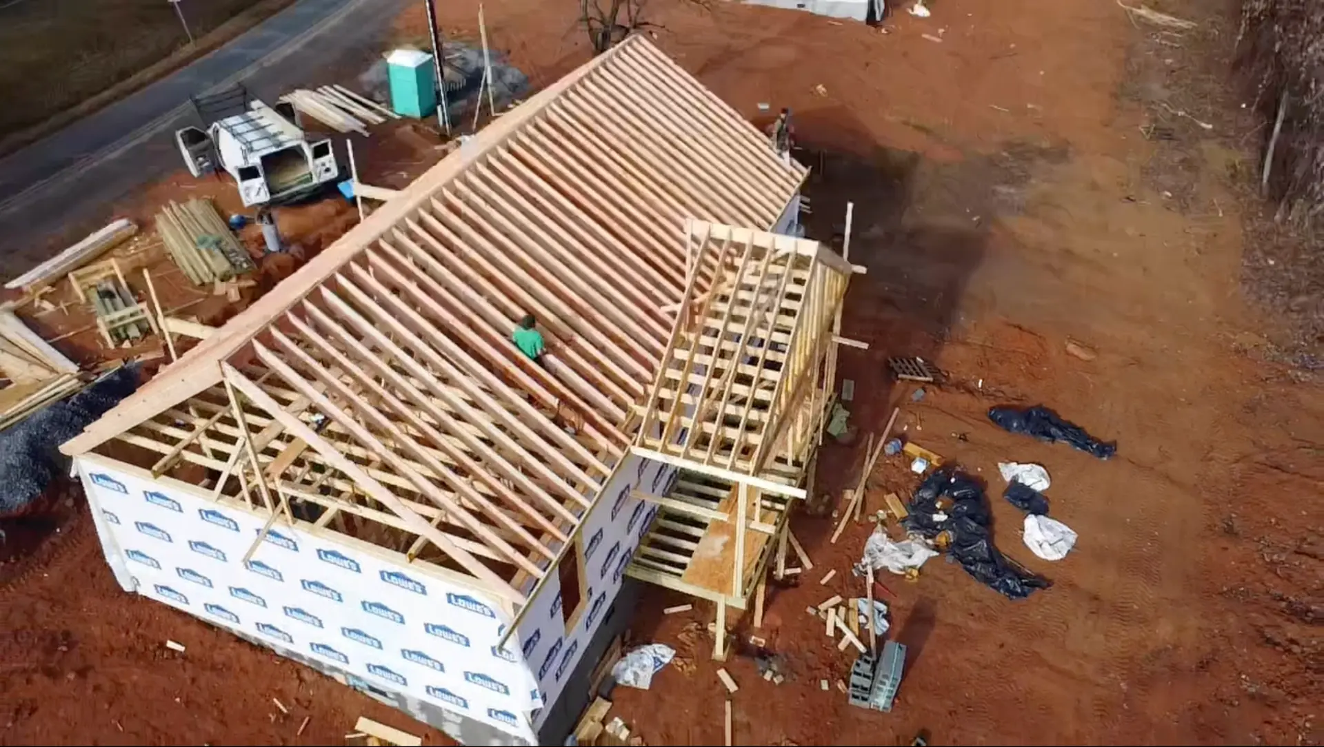 Aerial view of roof trusses being set on a new home under construction on Watson Rd in Lenoir, NC
